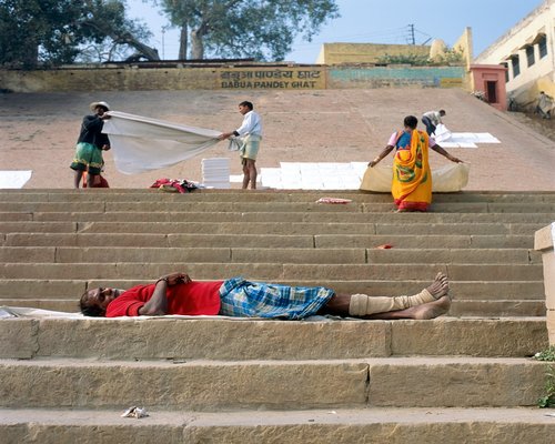 Person stretching in morning sunlight India